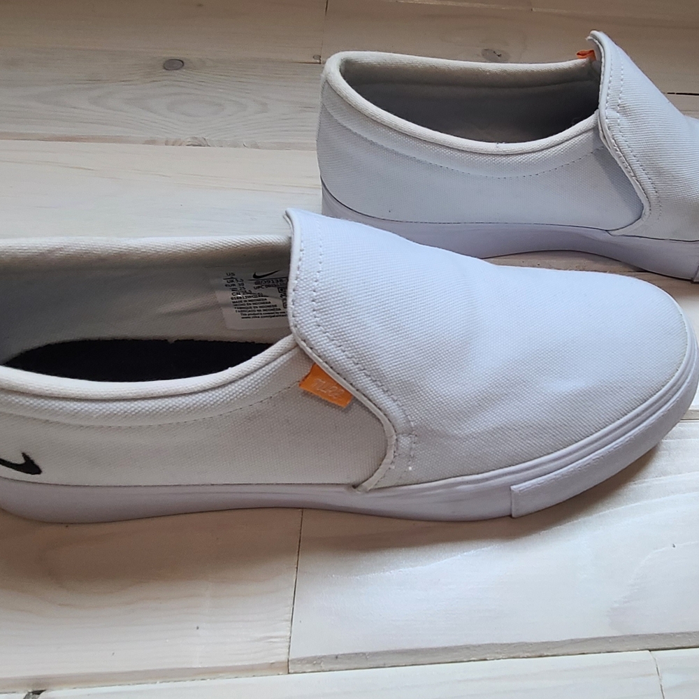 Nike White Slip-On Sneakers with Orange Accent